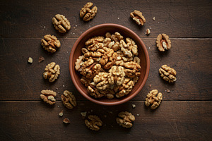 Shelled walnut halves in a wooden bo, a Food & Drink Photo by professorinc