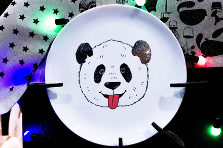 White plate with drawing pandas., an Arts & Entertainment Photo by Stockphoto by vzwer