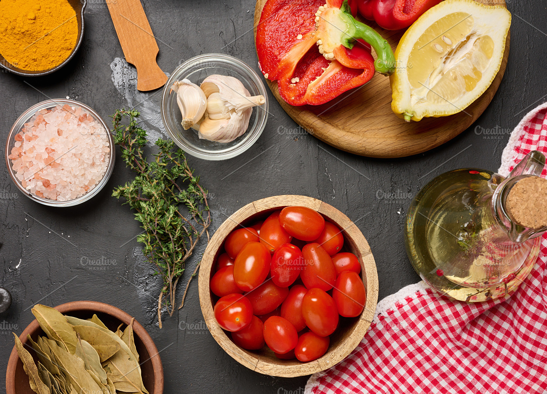 Fresh vegetables and spices with cherry tomatoes, garlic, lemon,, a Food & Drink Photo by ndanko