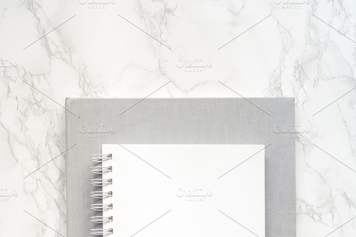 Notepad mockup on the marble desk, a Print Template by Una Matison (Photo 2 of 3)