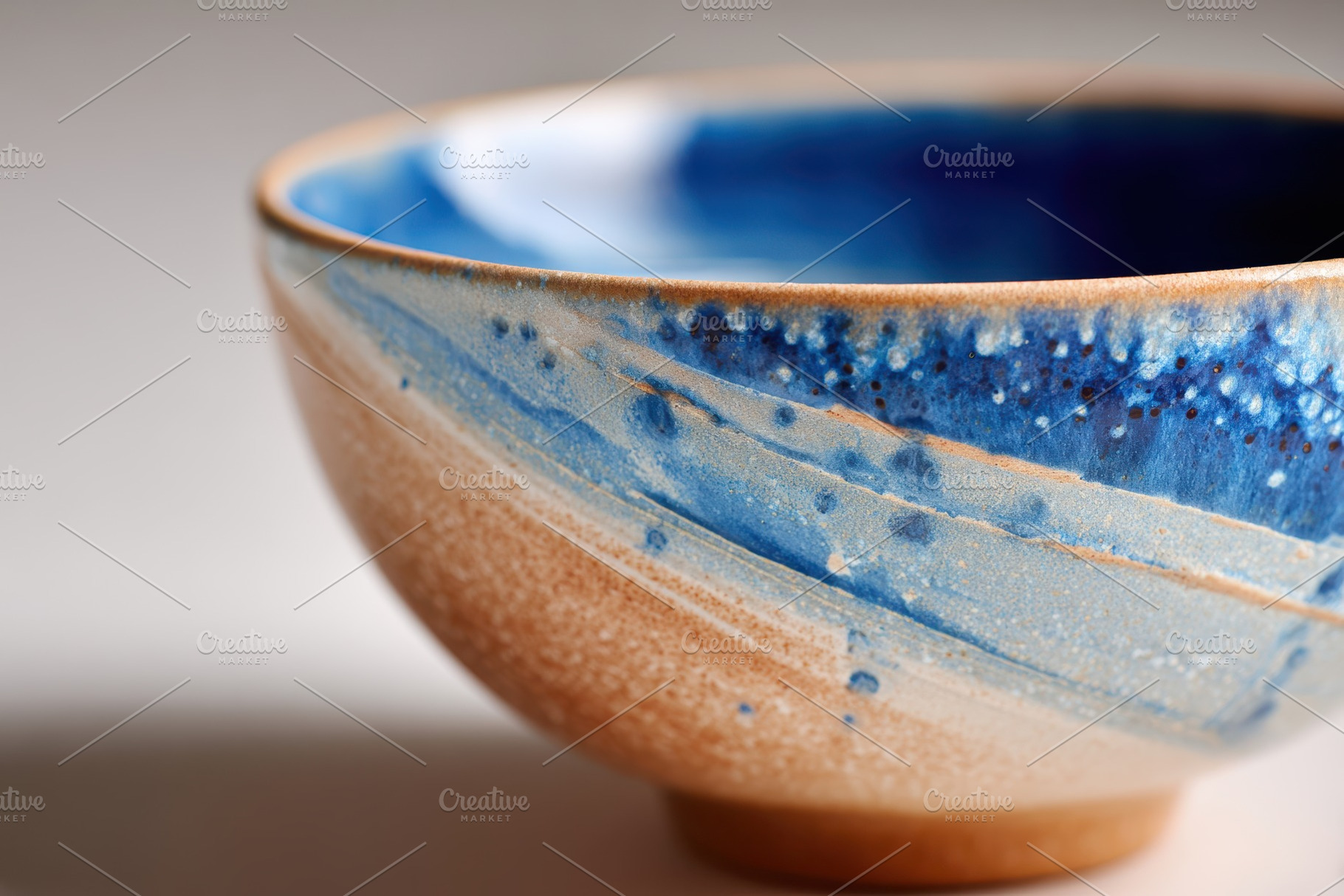 Blue and orange crackle glaze ceramic bowl close-up, a Food & Drink Photo by AlyaAnd