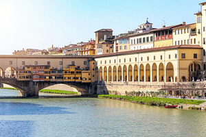 Ponte Vecchio and Vasari Corridor reflecting on Arno River in Florence, an Architecture Photo by Antonio Gravante Market