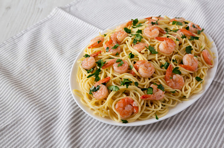 Homemade Shrimp Scampi with Pasta, side view. Space for text., a Food & Drink Photo by LiudmylaChuhunova