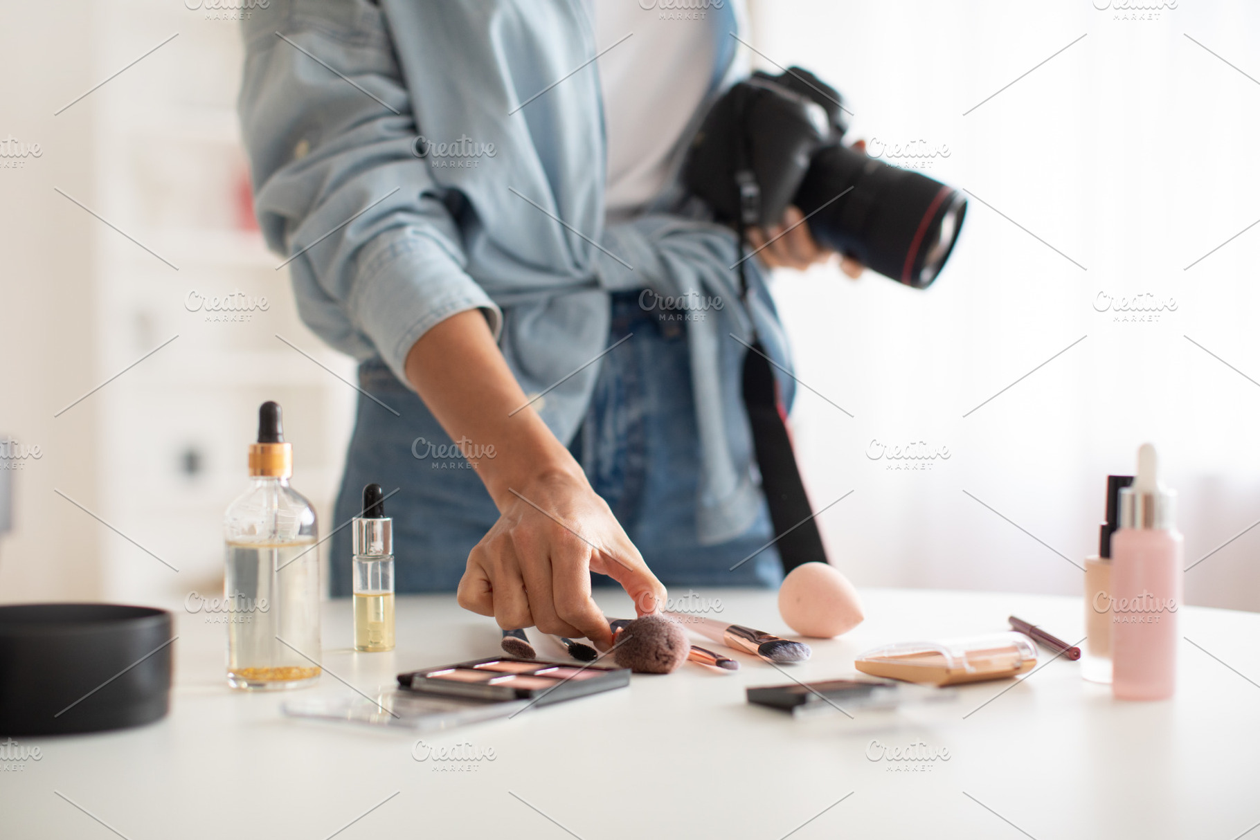 Unrecognizable Female Photographer Taking Photos Of Makeup Products Indoor, Cro, a Photo by Prostock-Studio