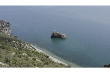 Top view of cross on coastal rock, a Nature Photo by Media Whale Stock