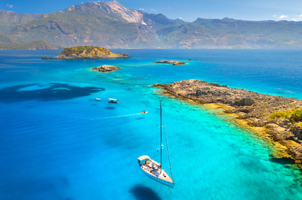 Aerial view of beautiful yachts and boats on the sea at sunset, a Nature Photo by den-belitsky