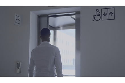 Man enters elevator with window, an Industrial Photo by Media Whale Stock