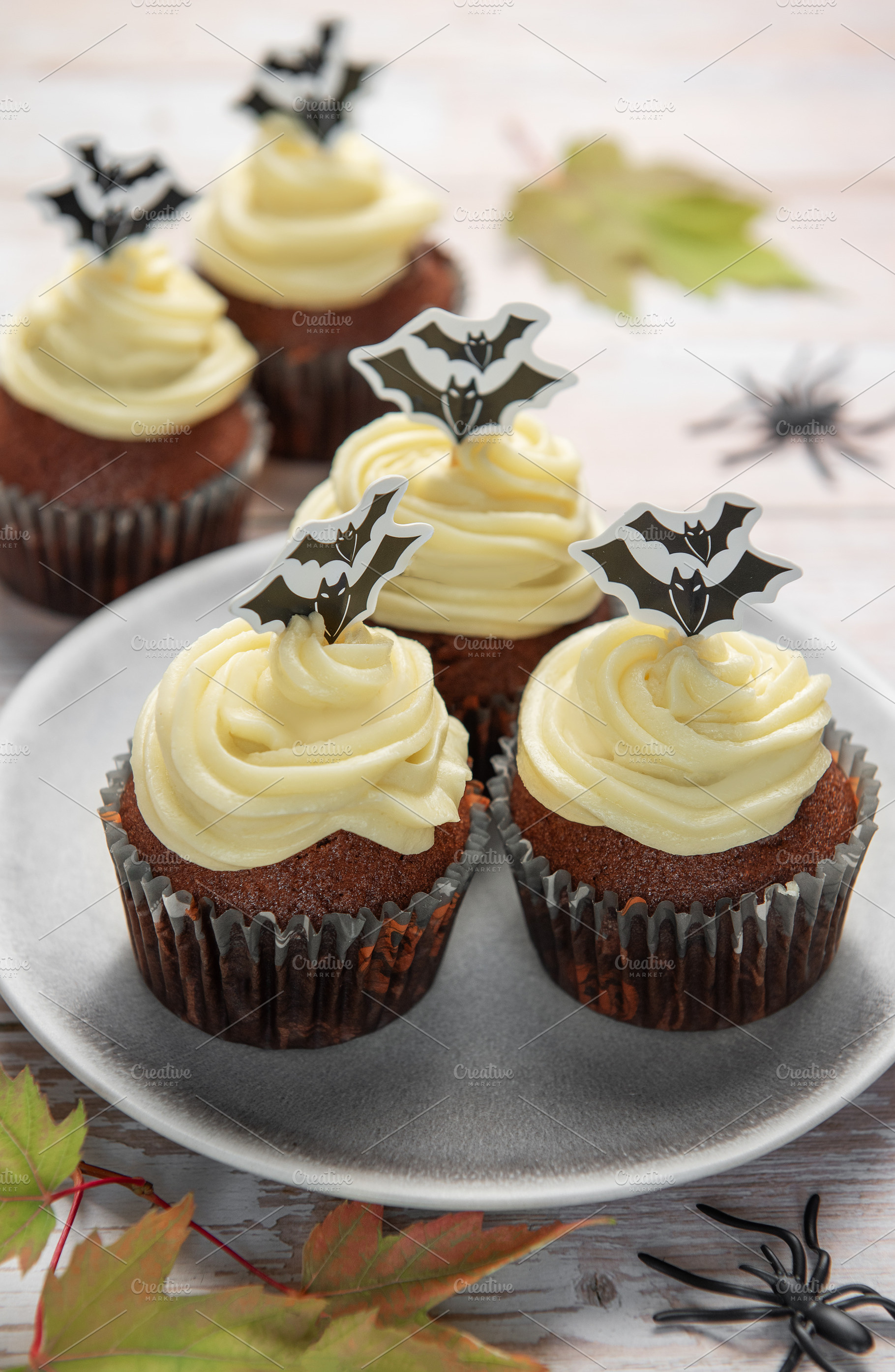 Halloween cupcakes with bat toppers and autumn leaves, a Food & Drink Photo by Olena Rudo