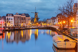 Windmill and canal houses in Leiden, an Architecture Photo by kavalenkava