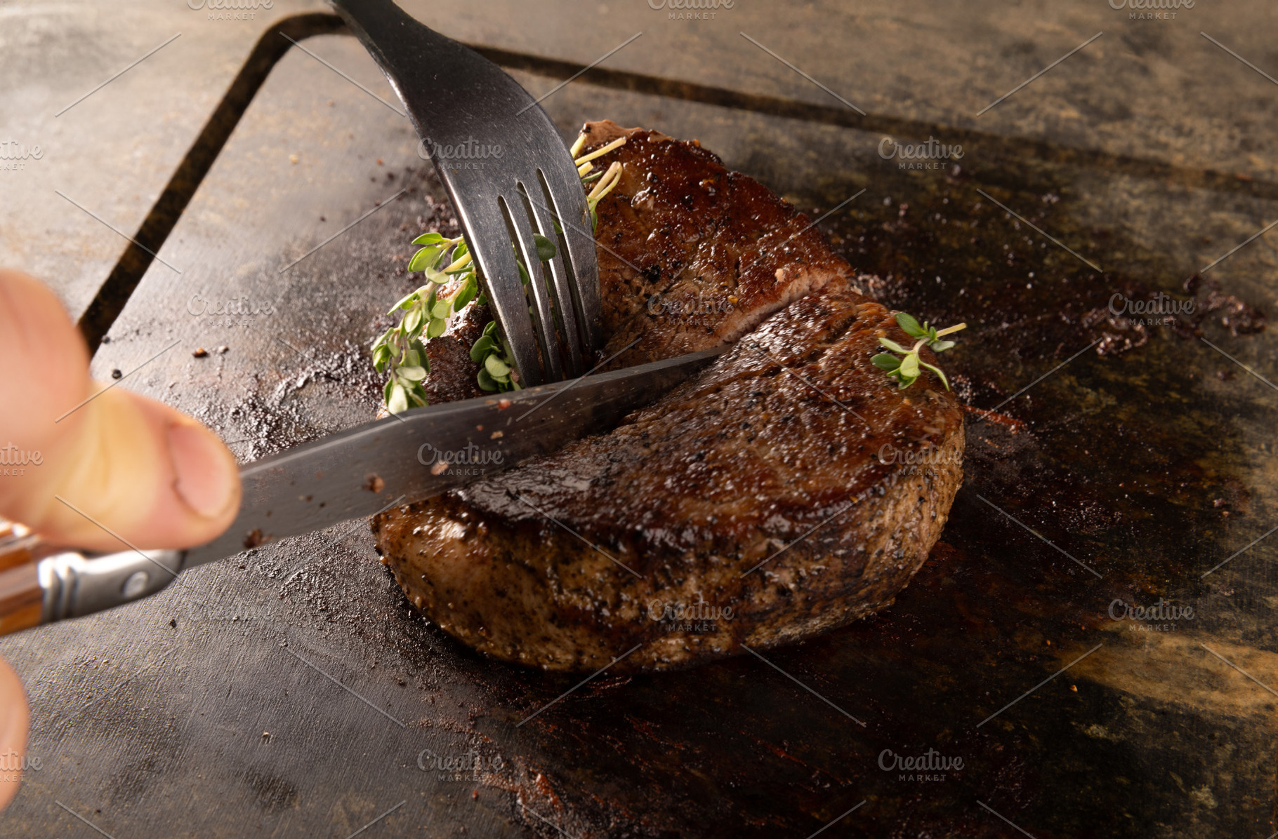 Chef cutting grilled steak, a Photo by Grafvision photography