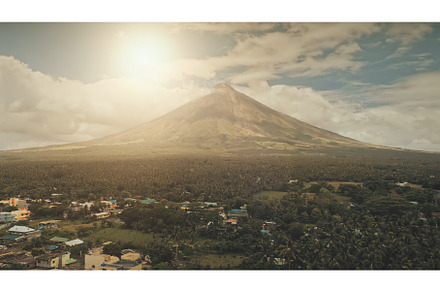 Aerial volcano erupt at sunlight, an Architecture Photo by Goinyk