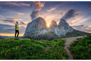Girl on the hill with yellow flowers, a Person Photo by den-belitsky
