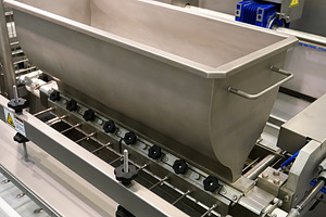 Food factory automated robotic production line featuring conveyor, product
