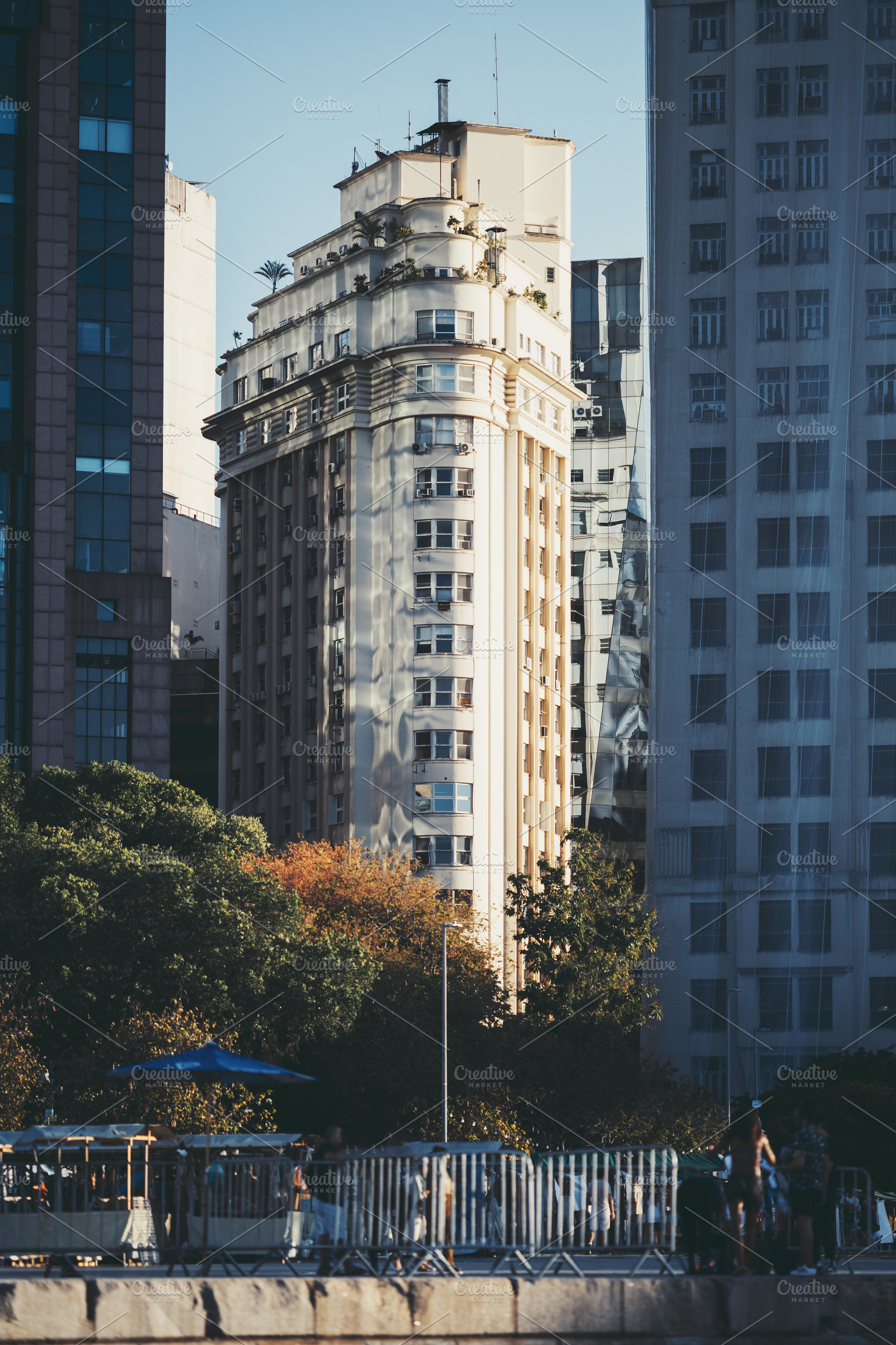 Sunlit historic tower in cityscape, an Architecture Photo by SkyNext