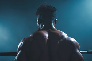 Strong man lifting weights in gym, a Photo by Beautiful things