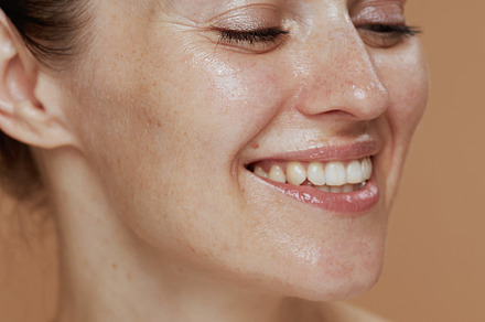 happy modern woman with wet face washing, a Person Photo by Alliance Images