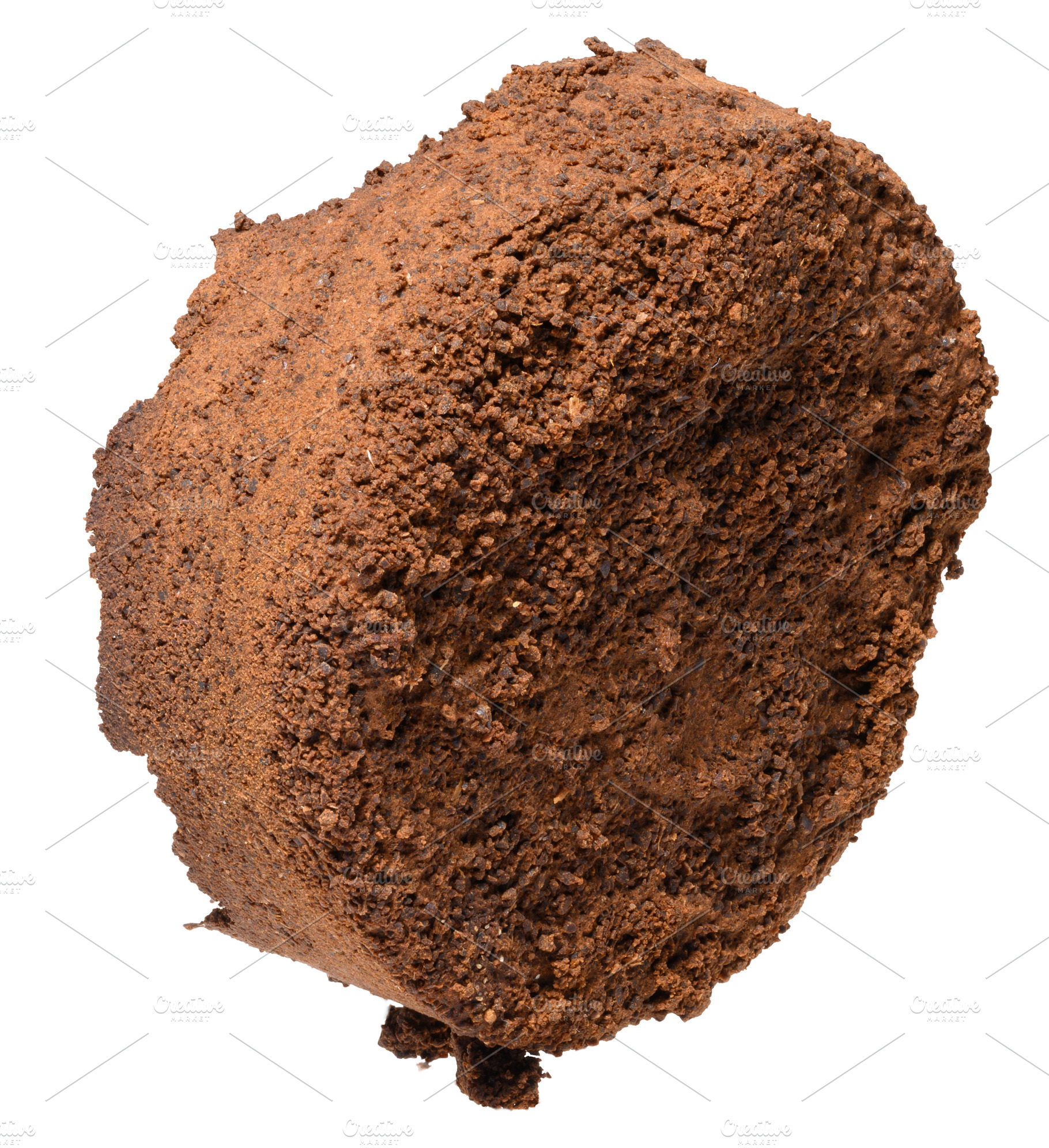 Pressed tablet of used ground coffee, coffee puck or cake, a Food & Drink Photo by ndanko