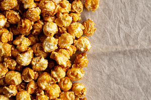 Homemade Caramel Pop Corn, top view. Space for text.