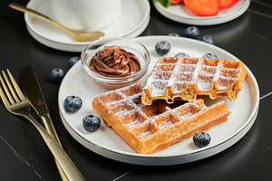 Belgium waffles Homemade waffles with strawberries, a Food & Drink Photo by Budarinphoto