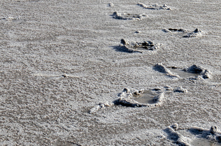 Footprints tracing a lonely path