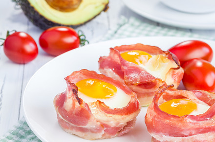 Baked eggs with avocado in bacon cups for breakfast, a Food & Drink Photo by iuliia_n