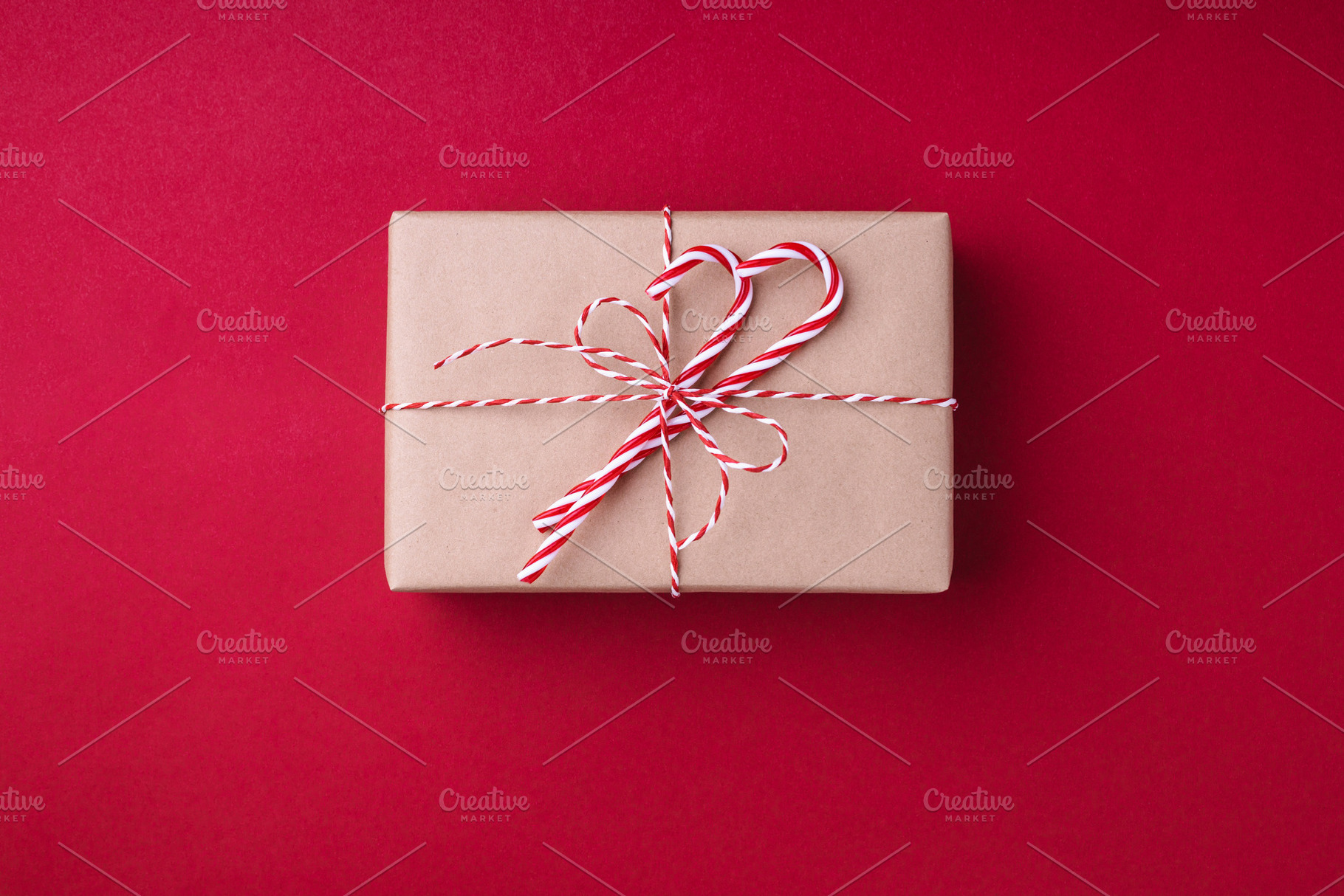 Gift box on red background featuring gift, box, and red, a Holiday Photo by Olga_Z