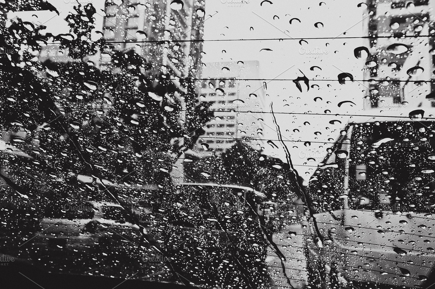 Rain drops on glass featuring glass, drops, and reflection, an Abstract Photo by kosmopolya