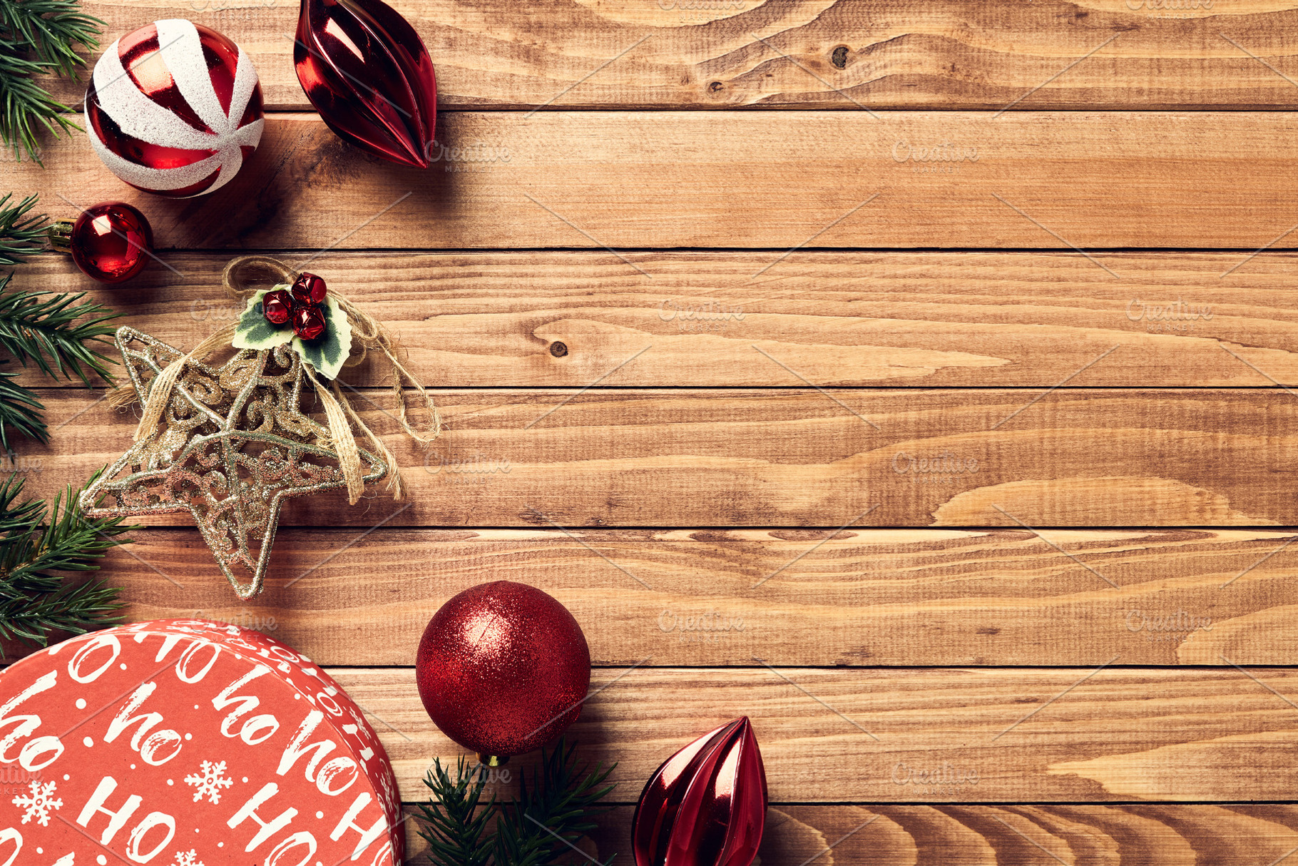 Vintage Christmas background with gift box, red baubles, star, fir branches on, a Holiday Photo by photoguns