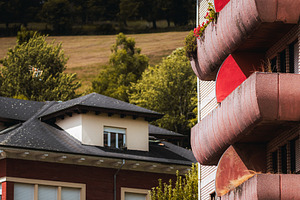 Curved red balconies and hills, an Architecture Photo by SkyNext