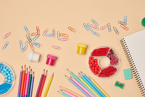 Flat lay of colorful school and office supplies including pencil, a School & Education Photo by ndanko