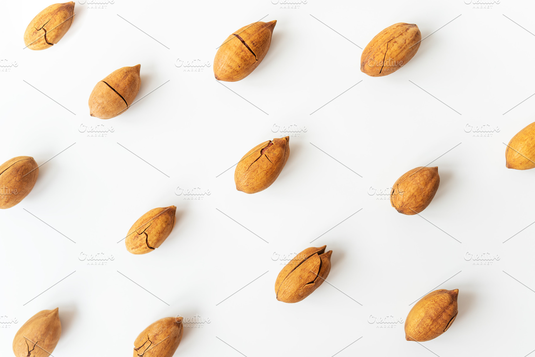 Shelled pecan on a white table. Healthy nuts, vegetarianism. Selective focus., a Food & Drink Photo by Artsaba Family