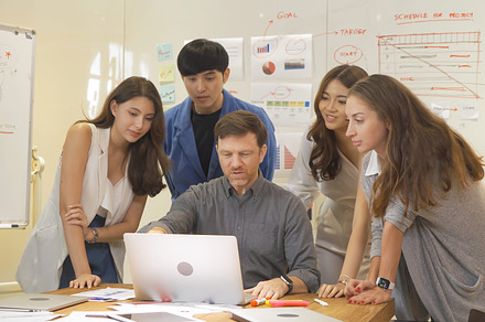 A group of multi ethnic business team talk, communicate, discuss, a Photo by Tampatra