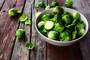 Fresh brussel sprouts featuring sprout, brussels, and green