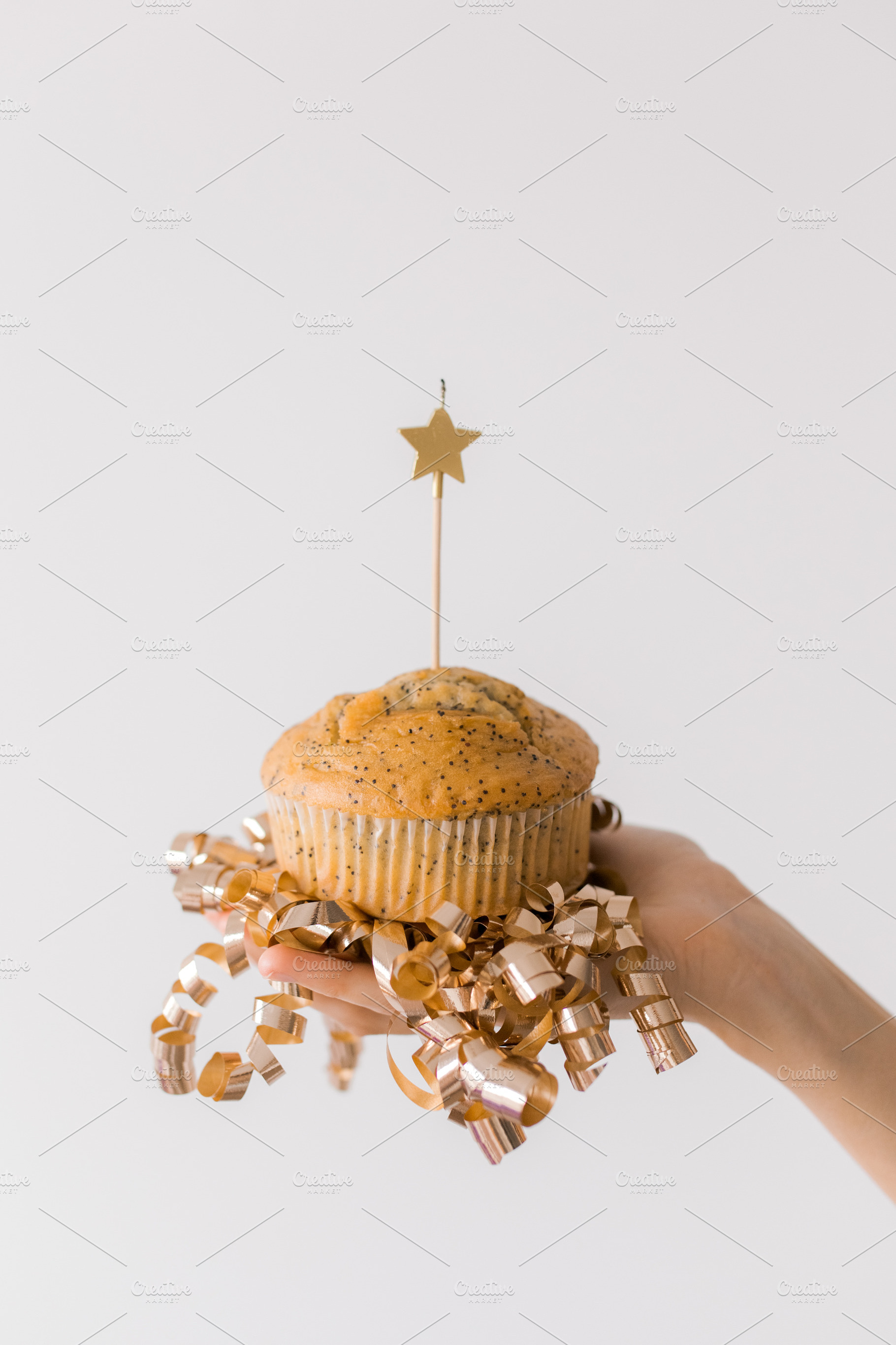 Birthday cupcake with a lit candle, a Food & Drink Photo by Kolomiyets Viktoriya