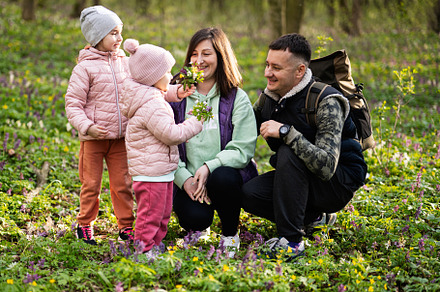 Family with two daughters on sunny forest. Outdoor spring leisur, a Person Photo by AS photostudio