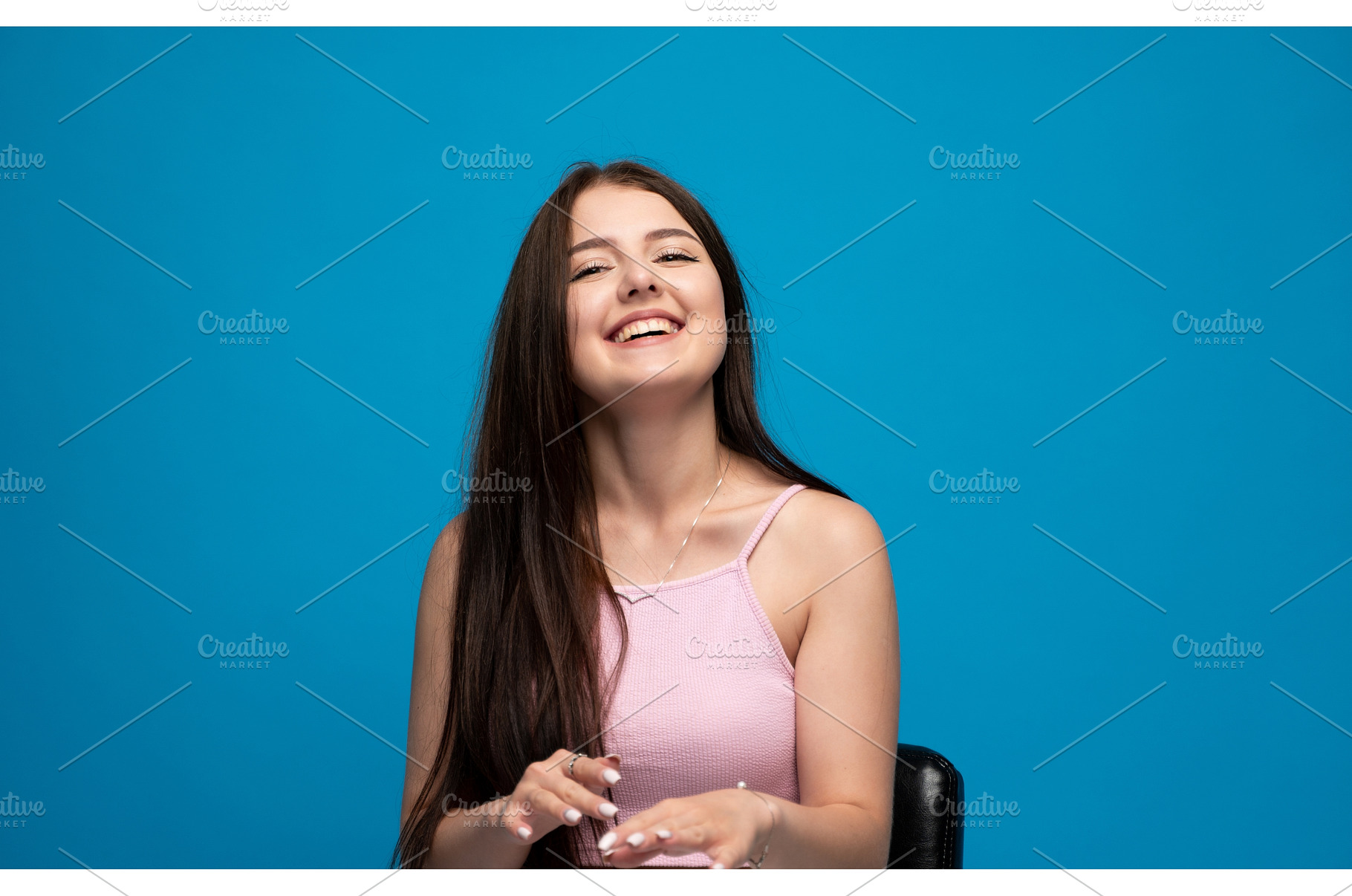 Smiling young woman posing with, a Person Photo by volodymyrshtun13795