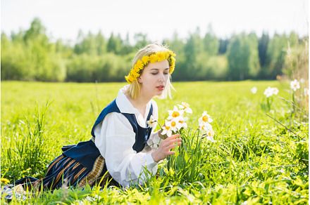 Young woman in national dress in a, a Nature Photo by COLORFUL