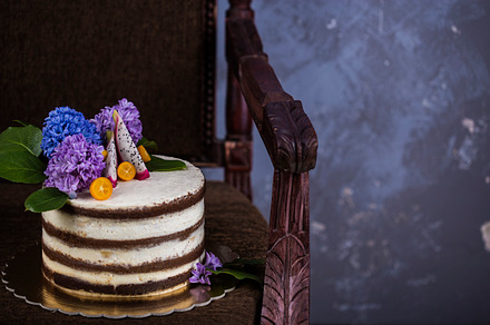 Chocolate cake with butter cream containing background, baked, and bakery, a Food & Drink Photo by Marina_Pronina