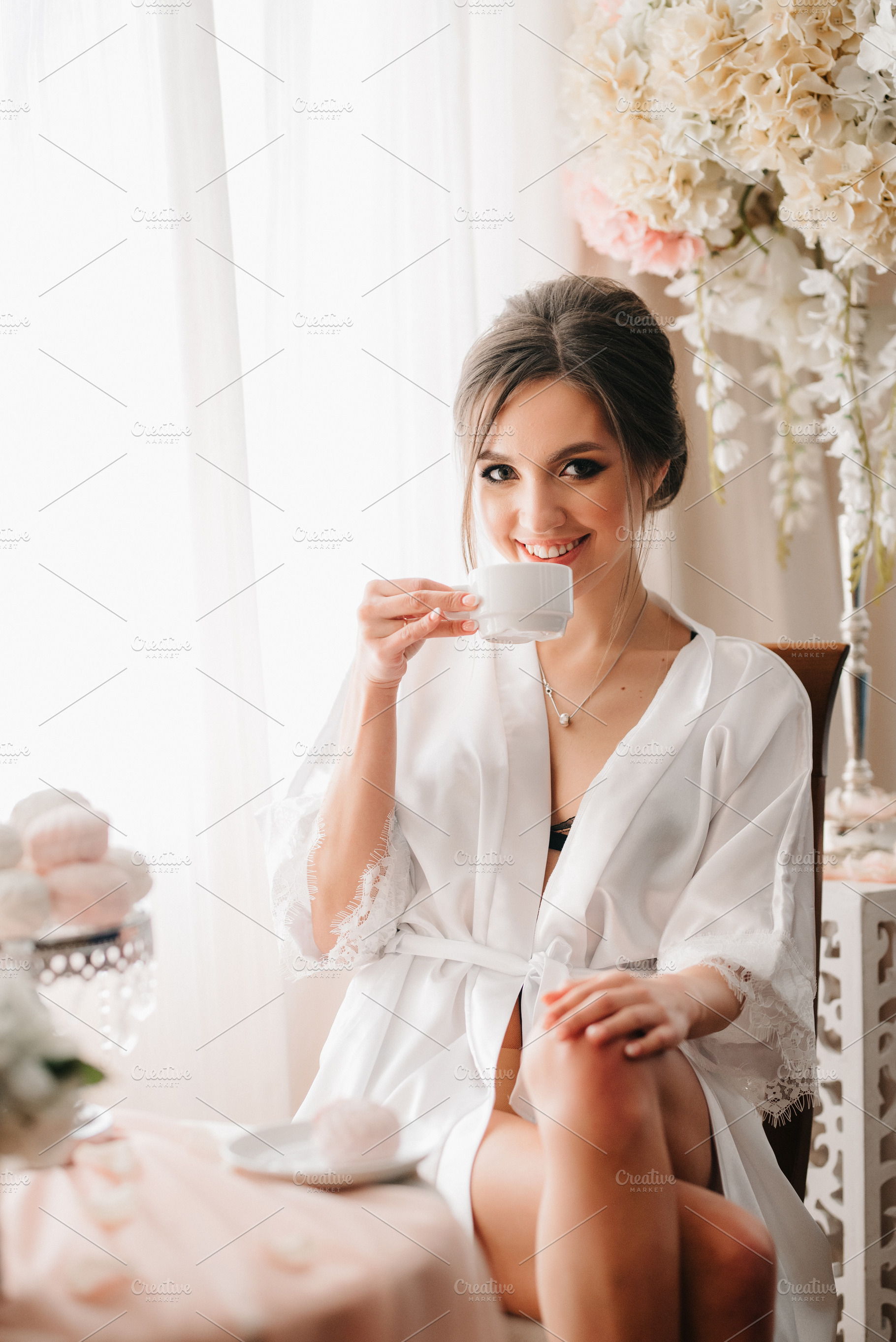 A young bride sits at a slot machine in the morning and drinks c, a Person Photo by Weddings, People, Travel