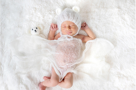 Newborn baby sleeps in a hat, a Beauty & Fashion Photo by yanadjana