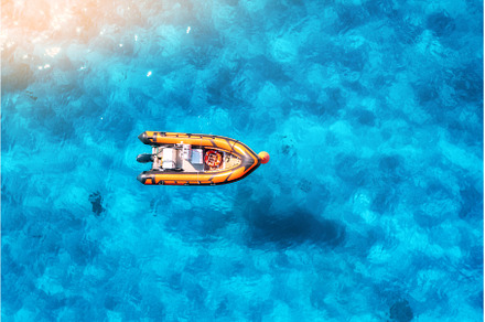 Aerial view of beautiful orange boat, a Nature Photo by den-belitsky
