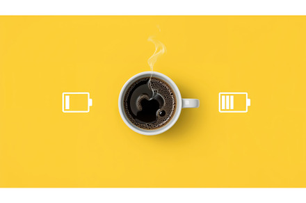 Steaming cup of coffee with battery