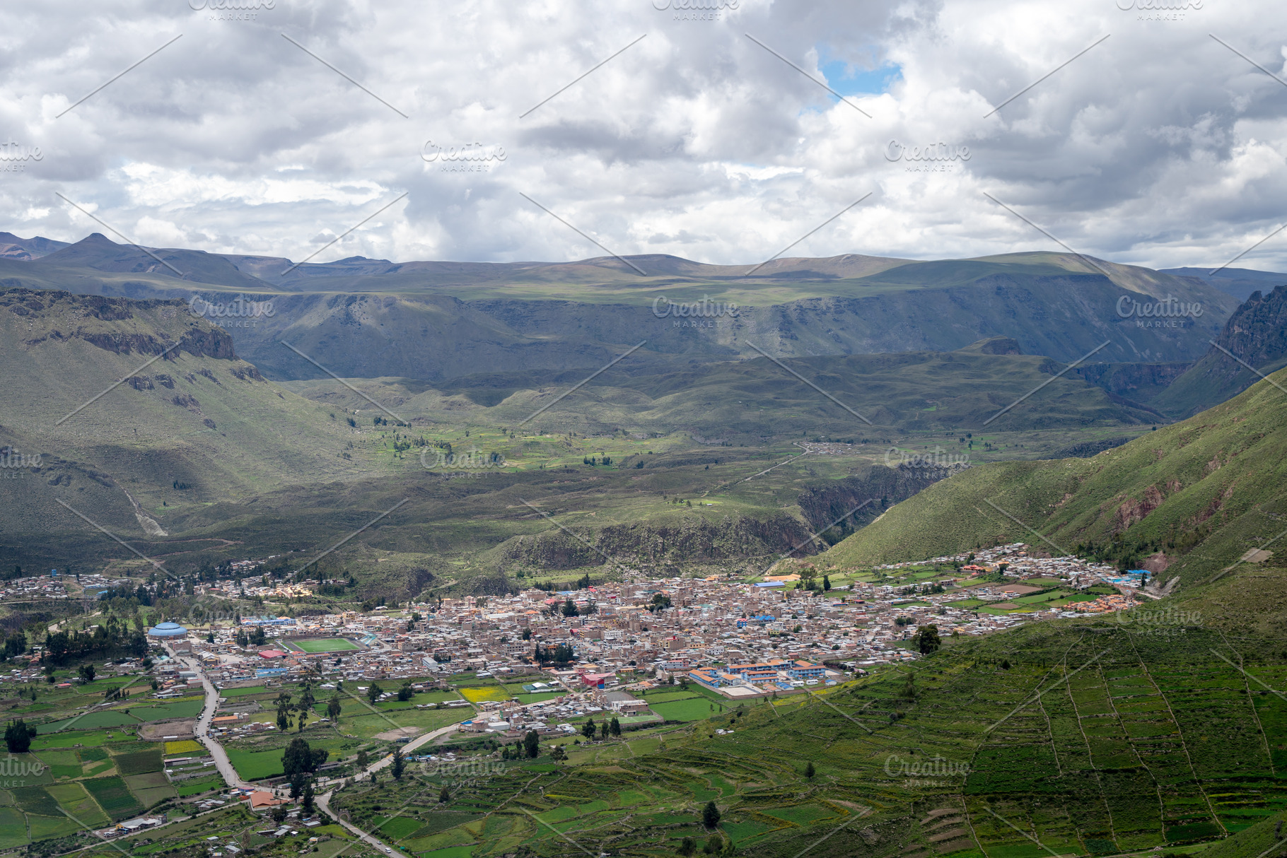 Chivay town in the Colca Canyon, Peru under dramatic clouds, an Architecture Photo by GoodGoods