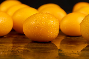 a large number of ripe orange tomatoes that are on the table, a Photo by rsoollAI