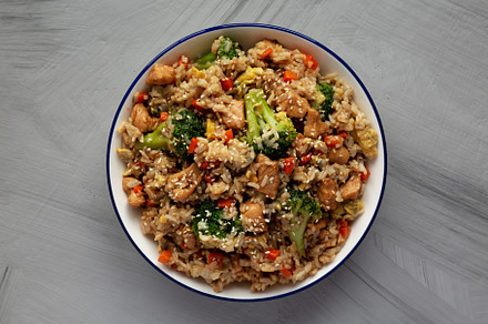 Homemade Chicken Teriyaki Fried Rice on a Plate, top view. Flat, a Food & Drink Photo by LiudmylaChuhunova