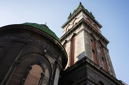 Historical architecture close-up of iconic church in Lviv under clear blue sky., a Photo by AS photostudio