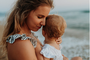 Tender moment between young mom and, a Person Photo by HalfPoint
