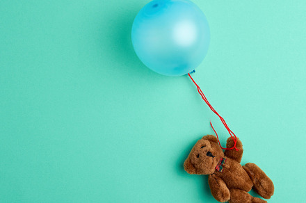 Little brown teddy bear holding a pi featuring green, animal, and baby, an Abstract Photo by ndanko