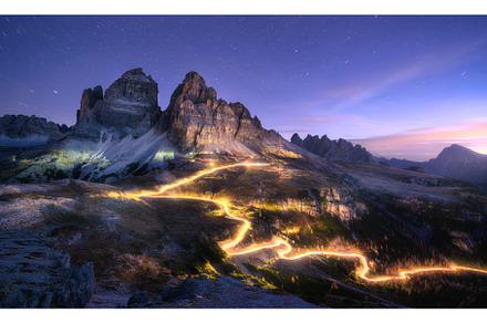 Car light trails on mountain road