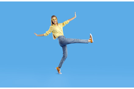 Funny young girl in shirt, jeans and, a Person Photo by StudioRomantic